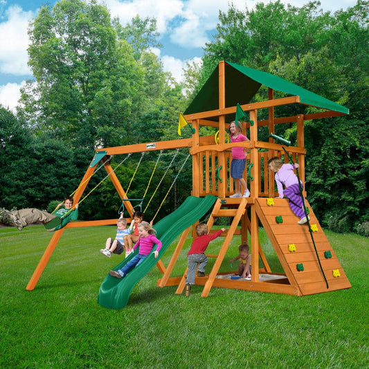 DYI Outing III Wooden Outdoor Playset with Tarp Roof, Rock Wall, Wave Slide, Swings, and Backyard Swing Set Accessories